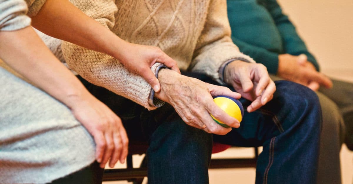 A carer supporting an elderly resident