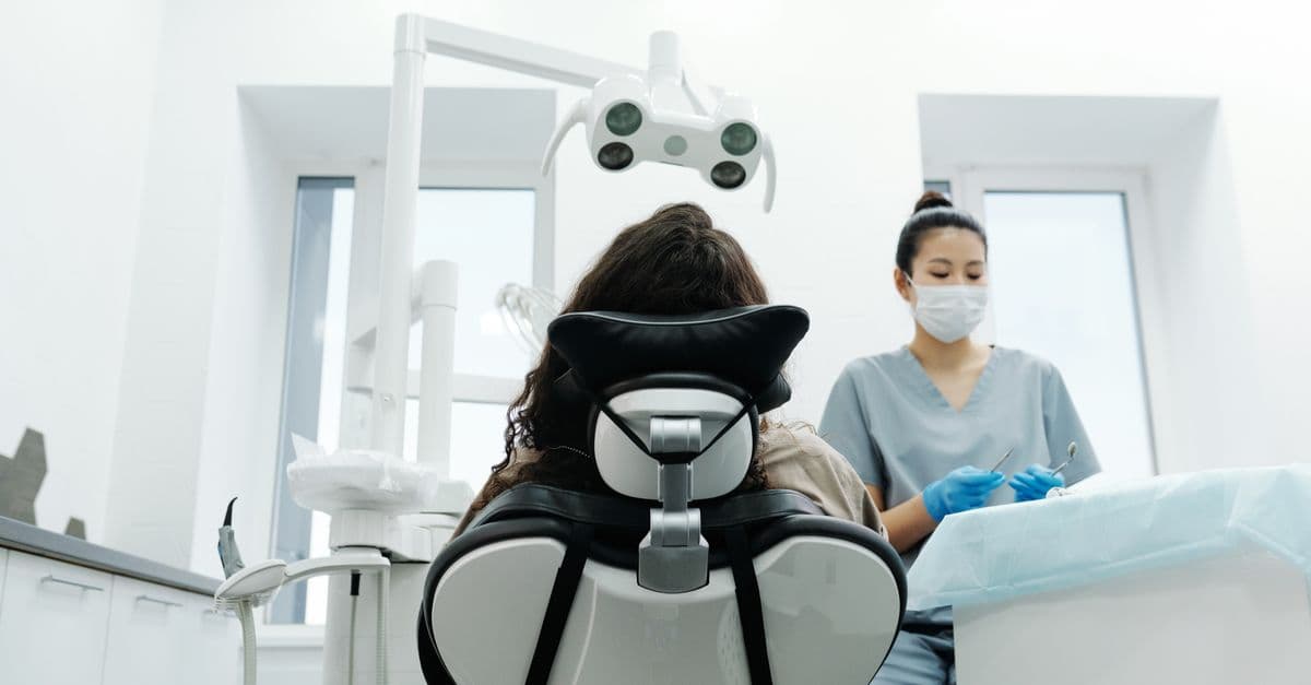 A dentist treating a patient in a modern clinic