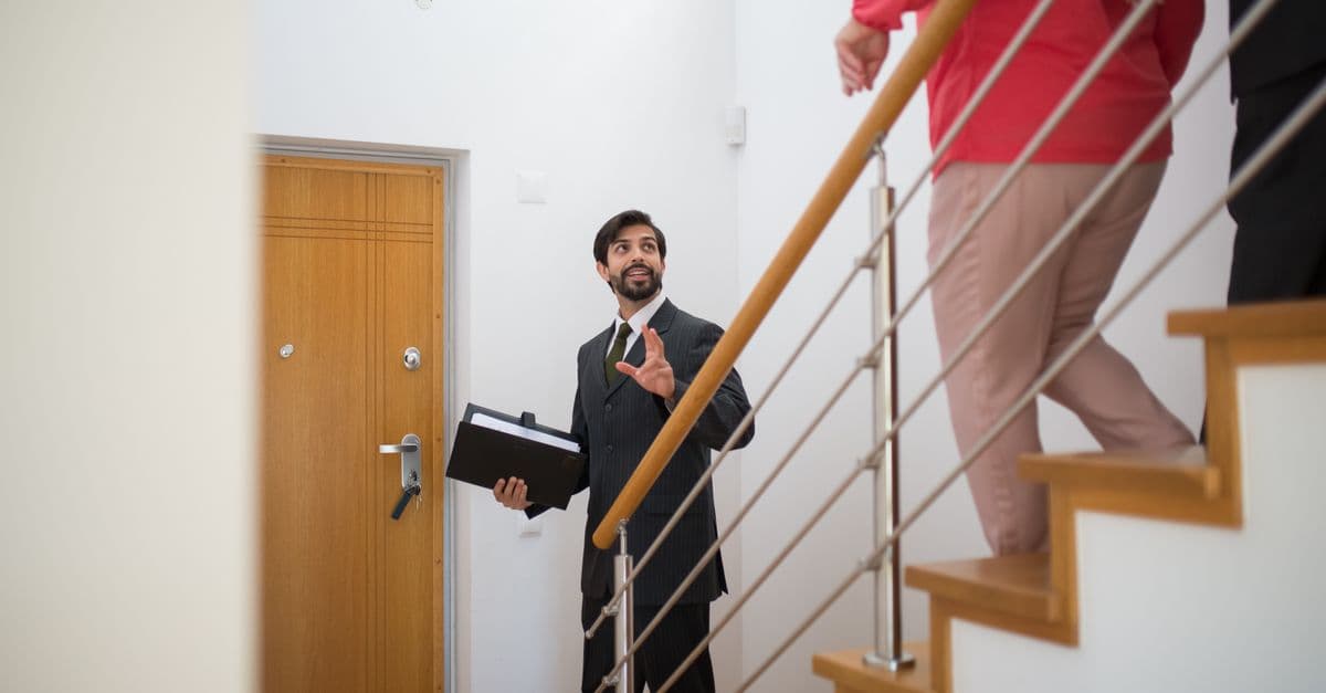 An agent showing a property to buyers