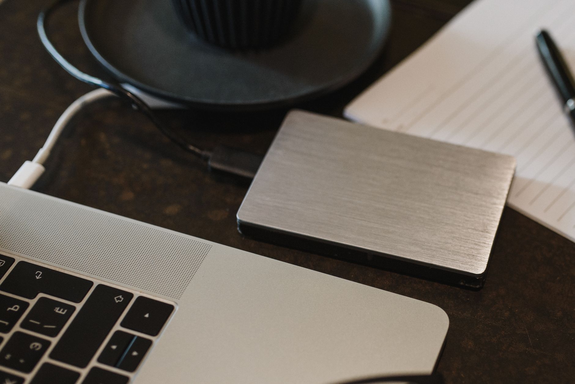 A portable drive plugged into a laptop