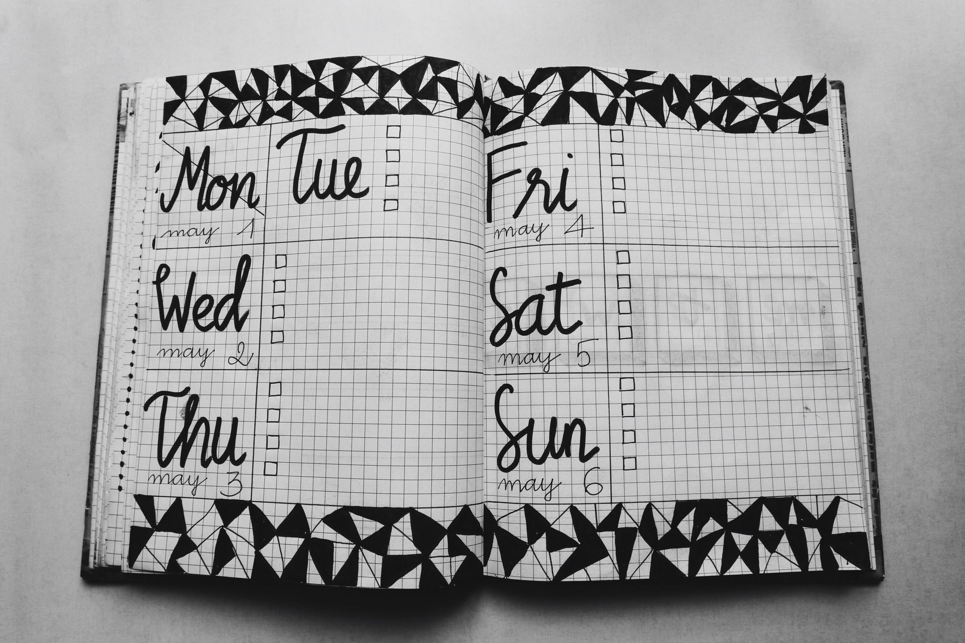 A weekly planner open on a desk