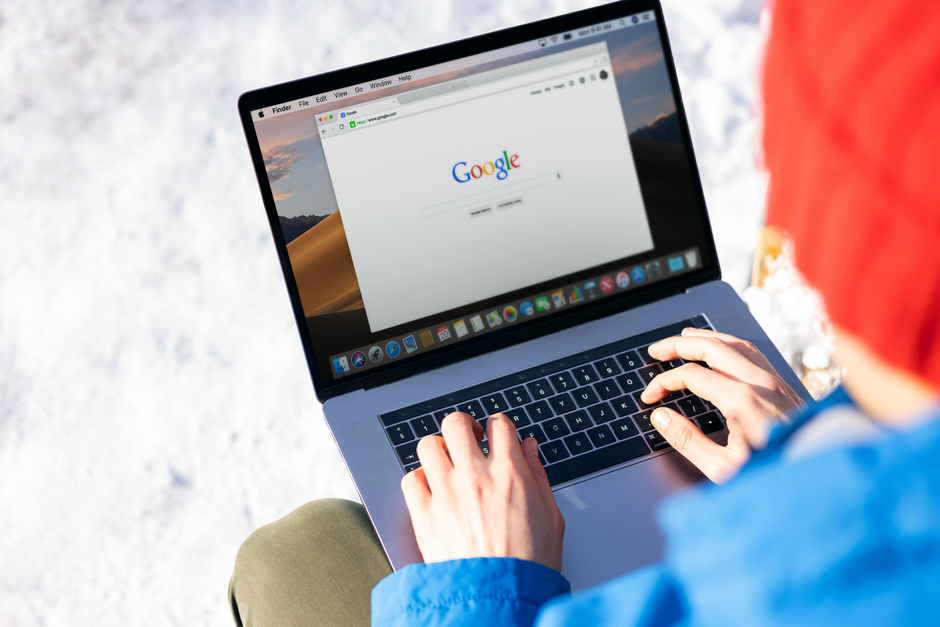 Someone using a laptop to search the web